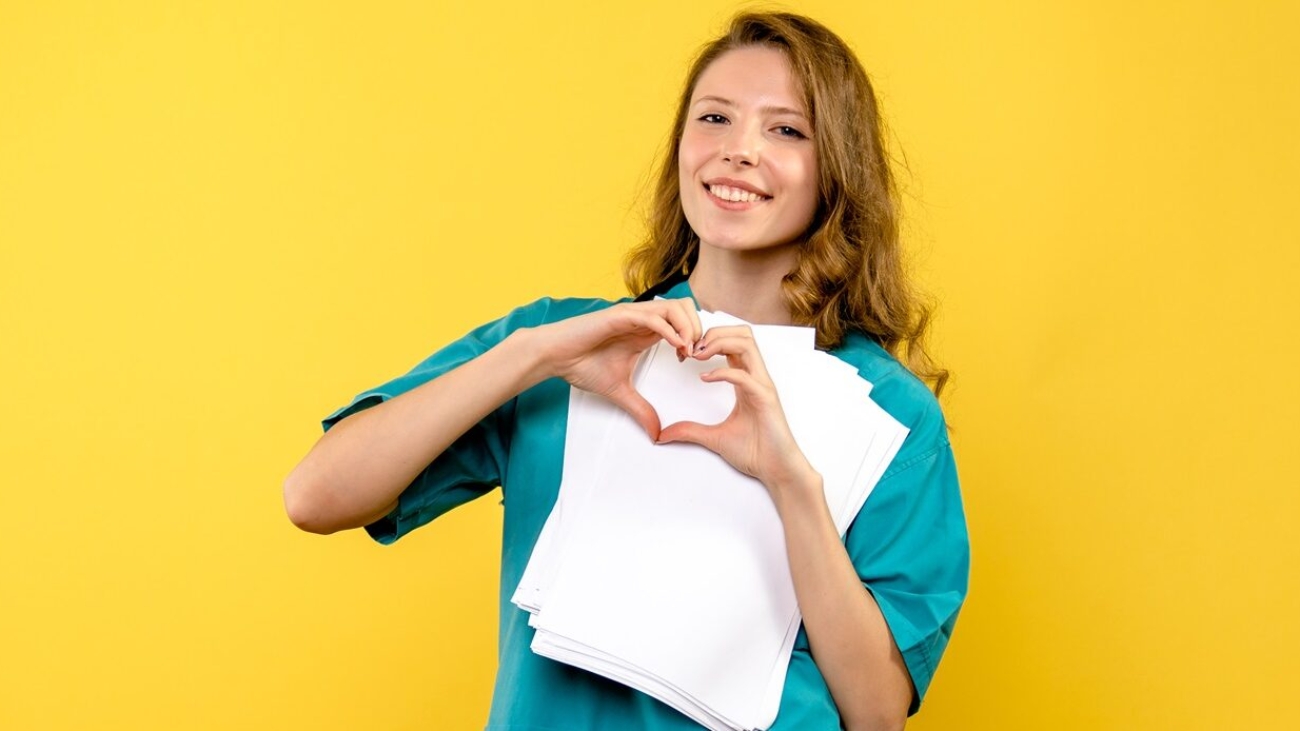 front view young female doctor sending love on yellow background virus model hospital medic